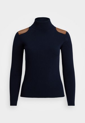 Marineblå turtleneck genser med ribbestruktur, med brune lærskuldre. Lange ermer og tettsittende design.