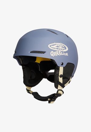 Matte blauwe Quiksilver helm met zwarte gevoerde oorbescherming, een beige verstelbare kinriem en ventilatieopeningen aan de boven- en zijkanten.