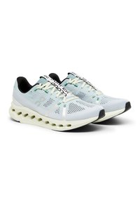 Light blue running shoes with a mesh upper, black accents, cream sole, and hollowed design for cushioning. Includes white laces.