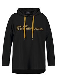 Sweat à capuche noir avec cordons de serrage jaunes, affichant un texte à l'avant qui dit "OFFLINE IS THE NEW LUXURY." Tissu doux, coupe décontractée, fentes latérales.