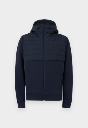 Tengerészkék cipzáras kapucnis pulóver párnázott, steppelt felső mellrésszel és állítható kapucnival, melyen húzózsinórok találhatók, két cipzáras oldalzsebbel.