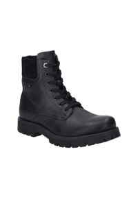 Bottines noires en cuir avec une finition texturée, bout rond, fermeture à lacets à l'avant et semelle en caoutchouc robuste. Comprend des accents en daim au niveau du col.