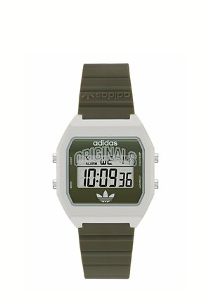 Montre digitale avec bracelet vert olive, boîtier rectangulaire blanc, affichant l'heure 10:09:36 et logo Adidas Originals sur le cadran.