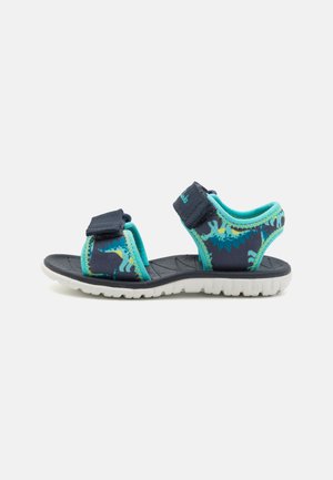 Navy blue sandals with turquoise accents, made of strap material; features two adjustable Velcro straps and a textured rubber sole.