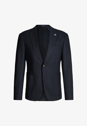 Dunkelblauer Marineblazer mit einreihiger Knopfleiste, Kerbkragen, zwei Fronttaschen und einer dezenten Struktur. Gefüttertes Innenfutter mit sichtbarem Markenetikett.