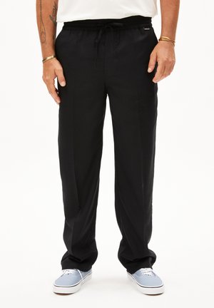 Black, lightweight, relaxed-fit pants with an elastic waistband and drawstring. The fabric has a smooth texture and side pockets.