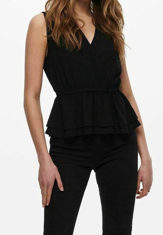 Top peplo nero con scollatura a V, design senza maniche e volant sovrapposti in vita. Realizzato in un tessuto morbido e liscio.