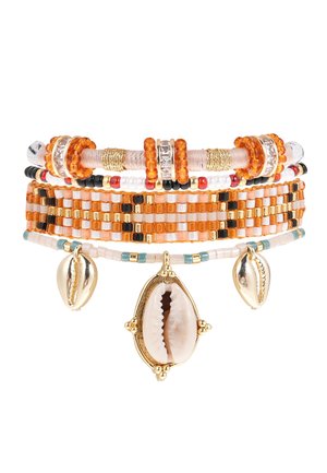 Multicolor bracelet featuring orange and black beads, white accents, gold hardware, and two shell charms. Crafted from various materials.