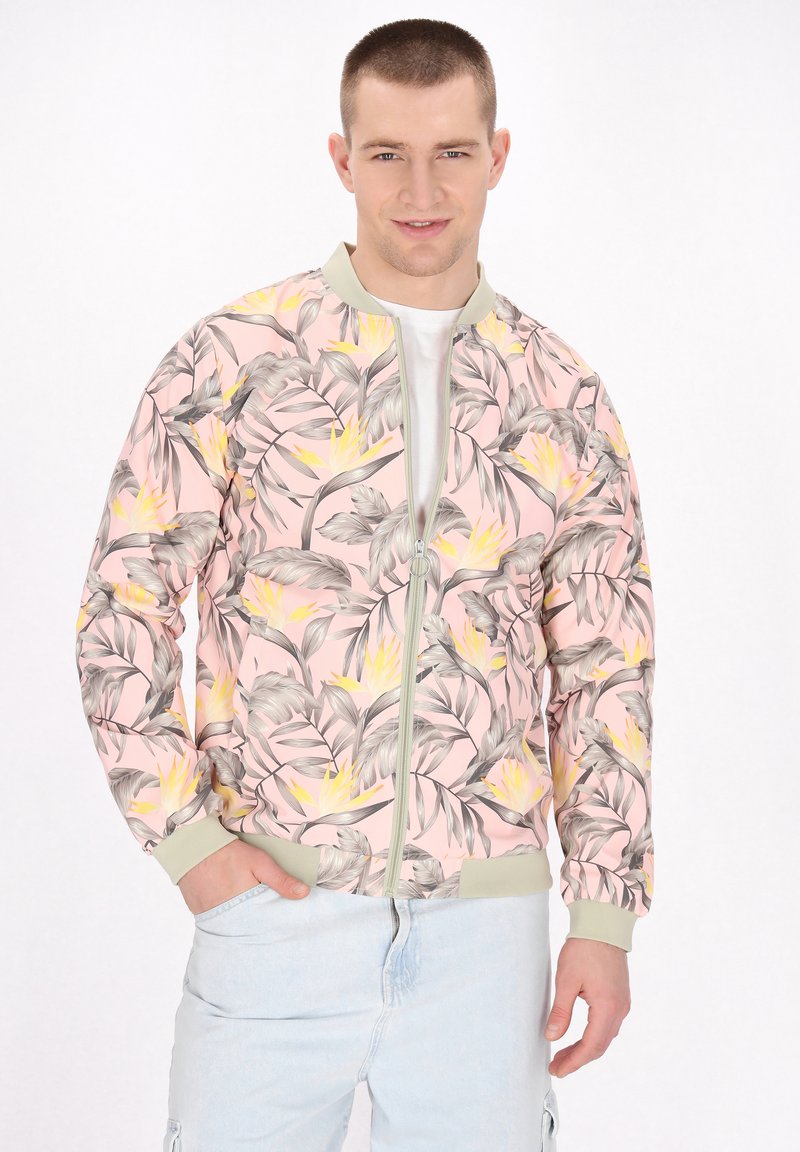 Bunda bomber s růžovým květinovým vzorem a šedými a žlutými akcenty, žebrovanými manžetami a zapínáním na zip. Hladký povrch látky.