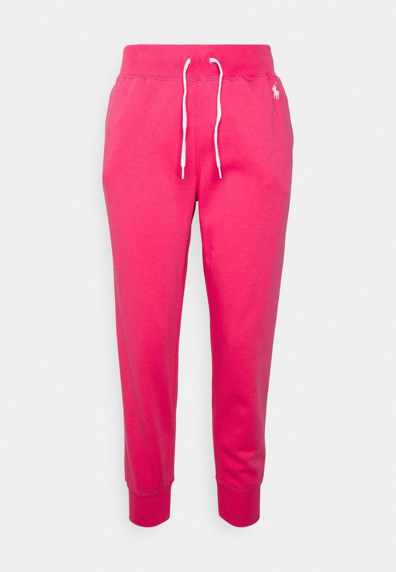 Rosa Baumwoll-Sweatpants mit weißem Kordelzug, schmal zulaufenden Beinen und gerippten Bündchen. Mit einem kleinen gestickten Logo an der Seite.