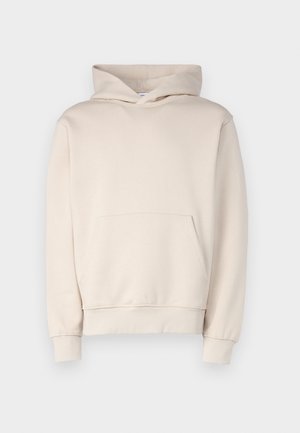 Beige hoodie made of soft fabric, featuring a front pouch pocket, ribbed cuffs, and a drawstring hood. Simple, unadorned design.