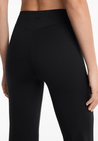 OYSHO NEOPRENE-EFFECT RISE FLARE  - Hlače - black