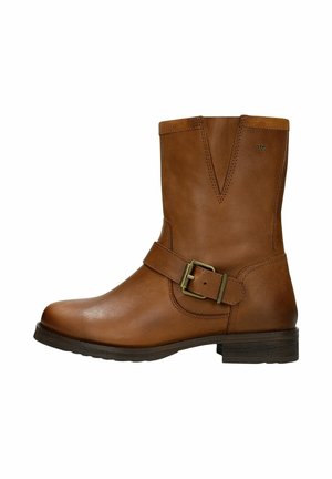 Brown leather ankle boot with a v-shaped top, a decorative strap with a buckle, and a low block heel. Smooth texture with stitching details.