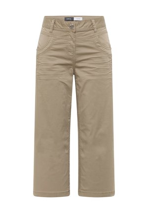 Beżowe spodnie o szerokich nogawkach z przodu zapinane na guziki i suwak, z bocznymi kieszeniami oraz przeszyciami na górnej części ud, oznaczone jako "Cecil Pants".