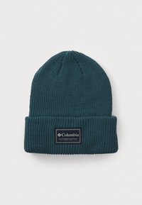Blue knitted beanie with a ribbed texture, folded cuff, and a rectangular black label featuring white text and logo.