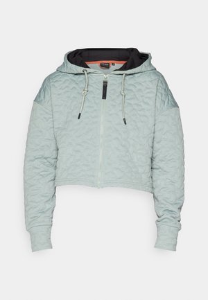 Afskåret, lyseblå quilted hoodie med en sort indvendig foring, frontlynlås, snøre i hætten og lange ærmer med tætsiddende manchetter.