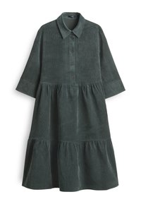 Abito in velluto a coste verde scuro con maniche lunghe, colletto, chiusura con bottoni e gonna a strati con texture arricciata.