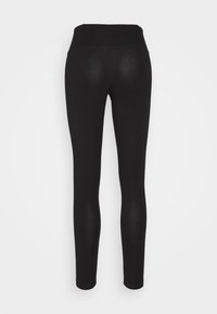 Svarta leggings med en slät yta, hög midja och åtsittande form. Kontinuerlig längd från midjan till ankeln, utan synlig hårdvara eller mönster.