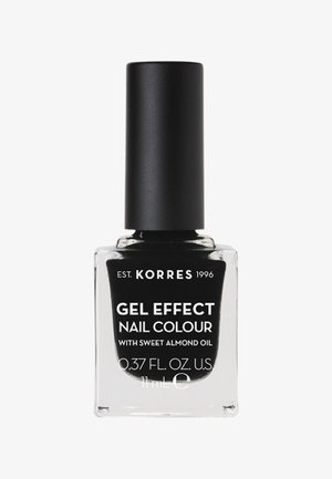 Korres Gel Effect Nail Colour in una bottiglia di vetro trasparente con un tappo nero. Il testo presenta un'etichetta bianca sul fronte, che indica "con olio di mandorle dolci."