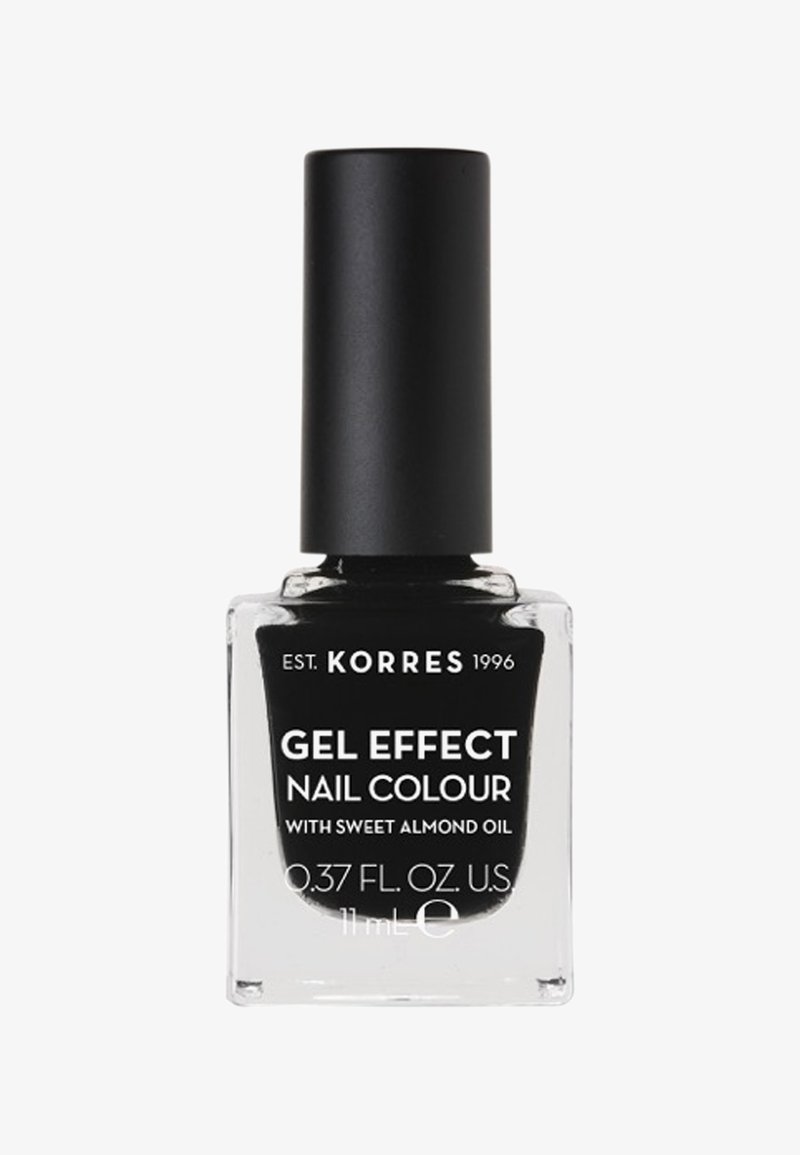 Korres Gel Effect Nail Colour in una bottiglia di vetro trasparente con un tappo nero. Il testo presenta un'etichetta bianca sul fronte, che indica "con olio di mandorle dolci."