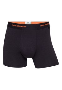 Mørkegrå boxershorts lavet af blødt stof, med en orange elastik på livet med "MADS NØRGAARD" logo. Klassisk benlængde med en tætsiddende form.