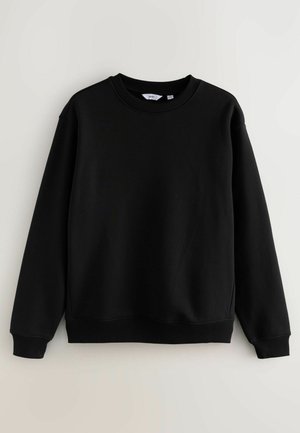 Svart sweatshirt i mjukt tyg, med rund halsringning, långa ärmar och ribbade muddar och nederkant, med en slät yta.