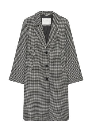 Jacke im Schachbrettmuster in Schwarz und Weiß, mit notchable Kragen, drei Knöpfen und Seitentaschen. Aus einem strukturierten Stoff gefertigt.