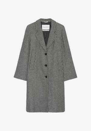 Jacke im Schachbrettmuster in Schwarz und Weiß, mit notchable Kragen, drei Knöpfen und Seitentaschen. Aus einem strukturierten Stoff gefertigt.