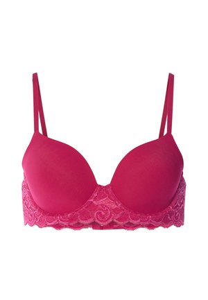 Jasně růžová vycpávaná podprsenka s nastavitelnými tenkými ramínky a krajkovým lemováním podél spodního okraje, na bílém pozadí.