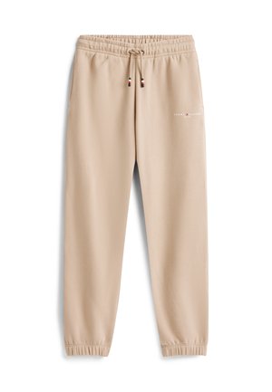 Pantaloni jogger beige con vita e polsini elastici, cordoncino regolabile, tasche laterali e piccolo logo Tommy Hilfiger sulla coscia sinistra.