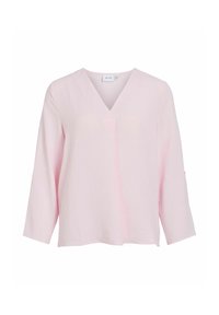 Blouse rose pâle à manches longues avec col en V, coupe ample et texture subtile, arborant un design minimaliste sans boutons ni motifs.