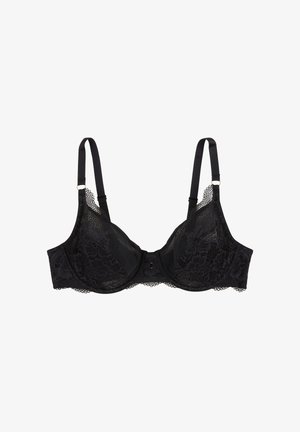 Soutien-gorge en dentelle noire avec bretelles réglables, soutien-gorge à armatures, superposition de dentelle florale et bords festonnés. Présente un détail de nœud au centre.