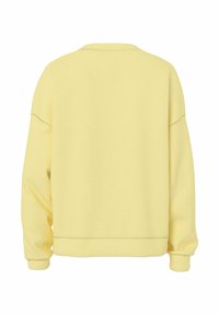 Felpa gialla con maniche lunghe, vestibilità relaxed e polsini a costine. Realizzata in tessuto morbido, presenta un design semplice e senza motivi visibili.