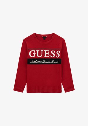 Red knit sweater with a round neckline, featuring a large white "GUESS" logo and a black accent stripe stating "Authentic Denim Brand."
