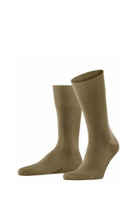 Chaussettes vert olive avec un ourlet côtelé, texture lisse, pointe et talon renforcés. Logo "FALKE" imprimé sur le côté.