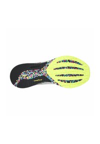 Suela de zapato con una base negra, acentos en amarillo brillante y un patrón moteado multicolor. Presenta ranuras texturizadas para mejorar la tracción.