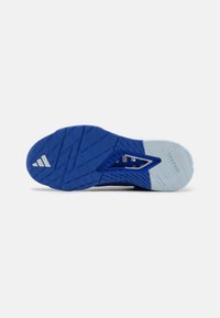 Blue athletic shoe sole with a textured pattern, featuring a distinct light blue section and silver accents, labeled "TRAXION."