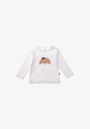 Weißes Langarm-T-Shirt mit einem braunen Cartoon-Hundedesign und einem schwarzen Barett, zentral auf der Vorderseite aufgedruckt.