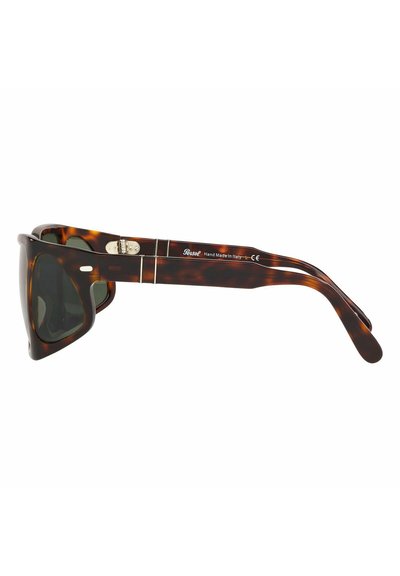 Occhiali da sole tartarugati con una montatura geometrica unica, lenti scure e dettagli in metallo sulle cerniere. Realizzati a mano con un design elegante.