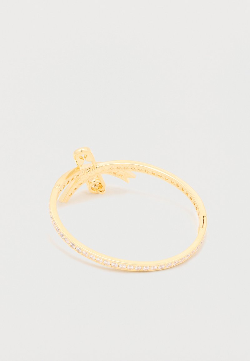 Gold-tone metal bracelet featuring a smooth surface with a row of clear rhinestones along one side. Hinged clasp for secure wear.