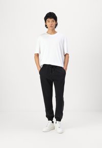 Hollister Co. Relaxed Fleece Joggers - Tracksuit bottoms - black beauty