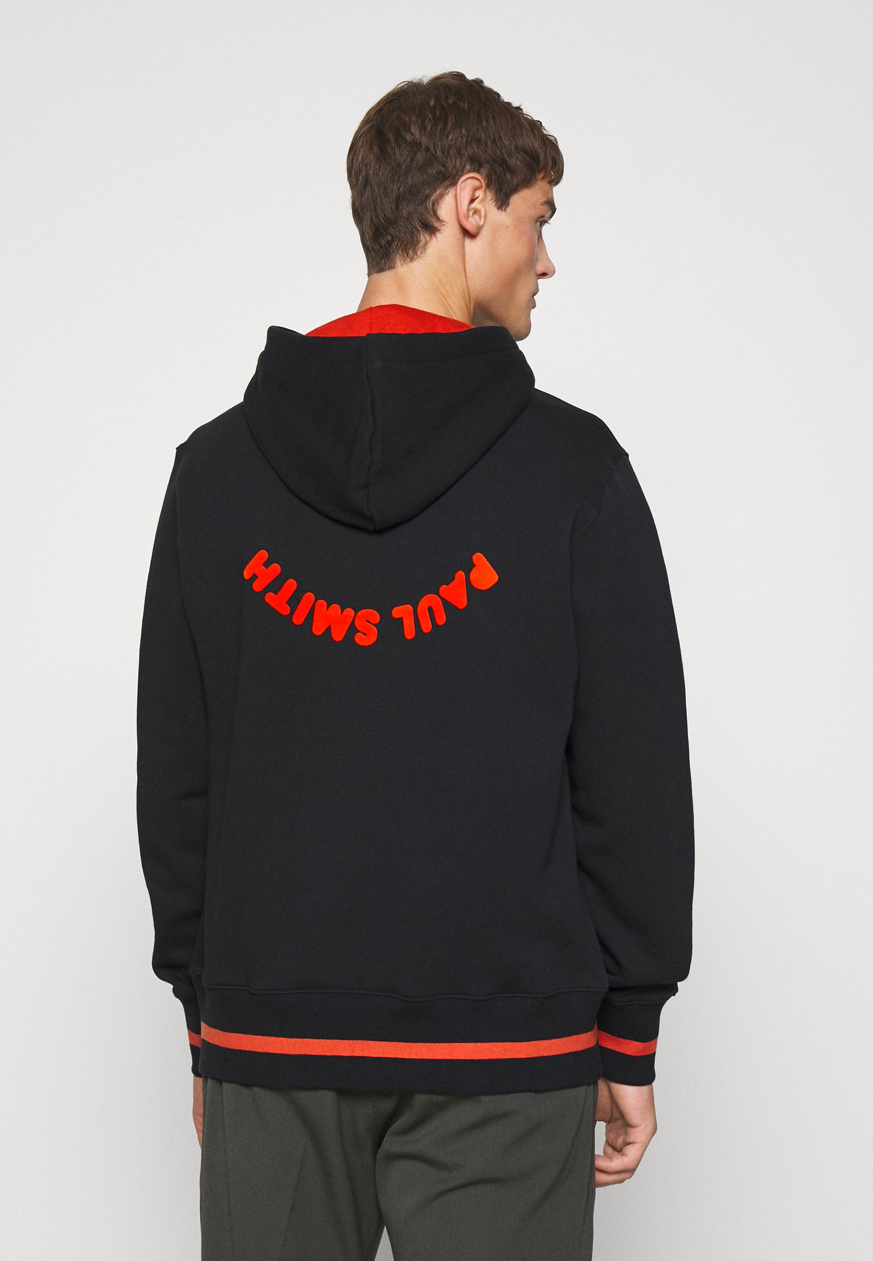orange and black hoodie be happy