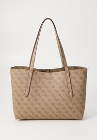 Sac fourre-tout marron avec surface texturée et motif logo subtil. Deux longues anses plates et accents dorés sur les côtés. Design à ouverture supérieure.