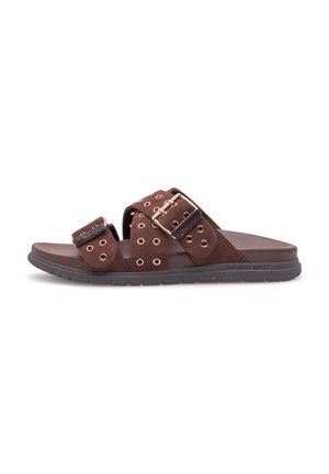 Brown suede sandals with two wide straps, gold eyelets, and a large buckle accent. Features a contoured, cushioned sole for comfort.