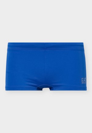 Blå herresvømmebukser med tætsiddende design og lille "EA7 Emporio Armani"-logo i hvid på nederste højre side.