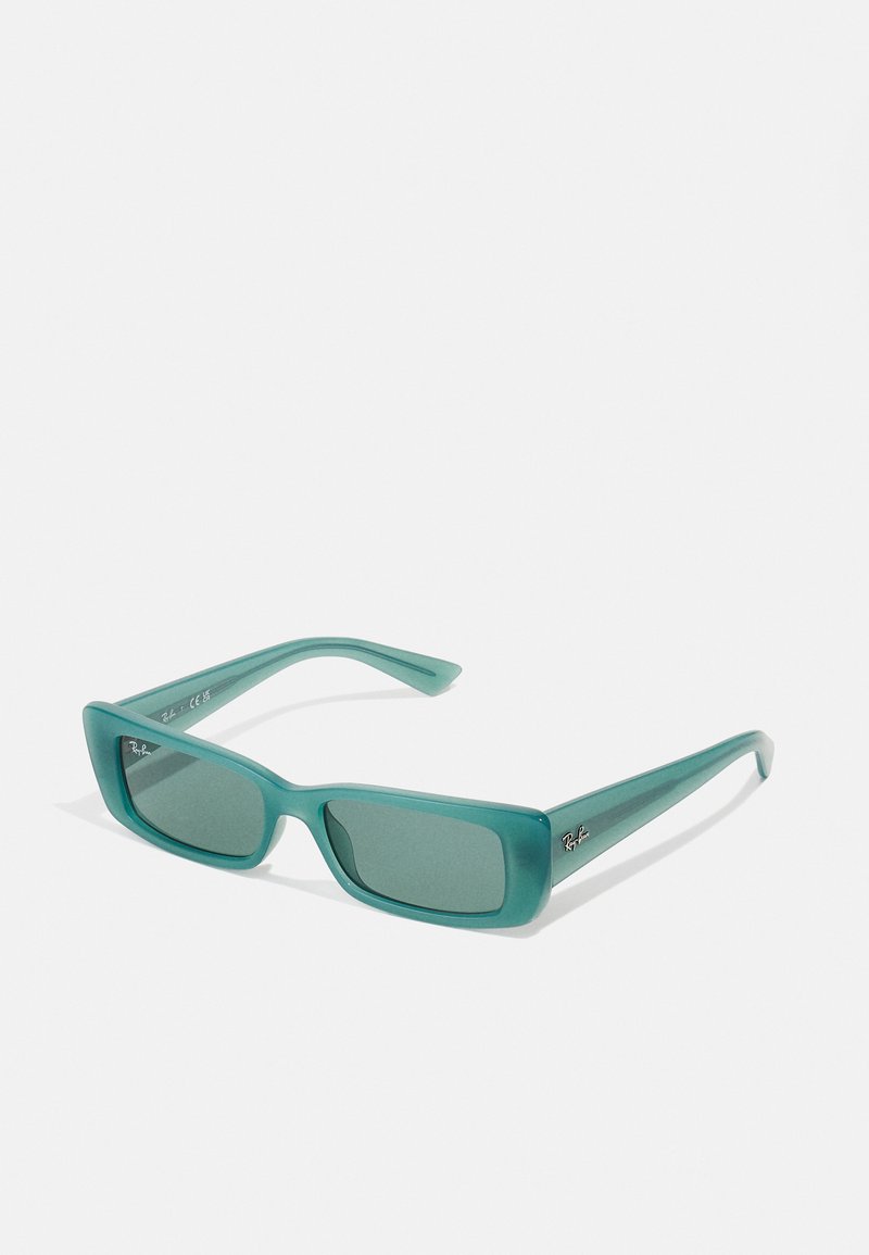 Turquoise sunglasses with a rectangular frame, made of translucent plastic, featuring dark lenses and a small logo on the side.