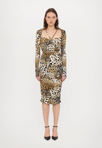 Fitted leopard-print dress featuring long sleeves, a sweetheart neckline, and ruched fabric in shades of brown, black, and cream.