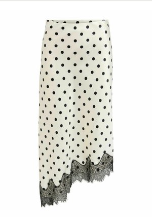 Jupe midi blanche à pois noirs avec bordure en dentelle noire à l'ourlet asymétrique.