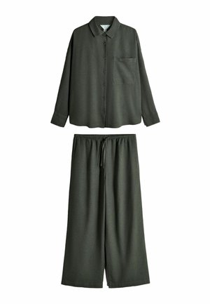 Dark green long-sleeve button-up shirt with chest pocket paired with matching wide-leg pants featuring an elastic waistband and drawstring.
