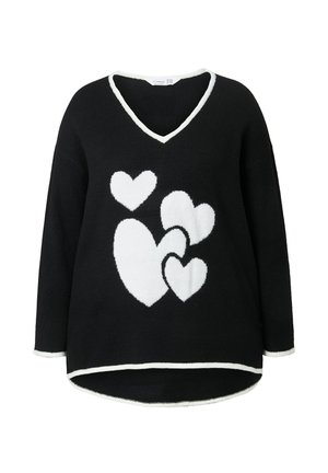 Černý svetr s výstřihem do V, zdobený bílými vzory srdcí. Měkká textura, dlouhé rukávy a kontrastní bílý lem na okrajích.